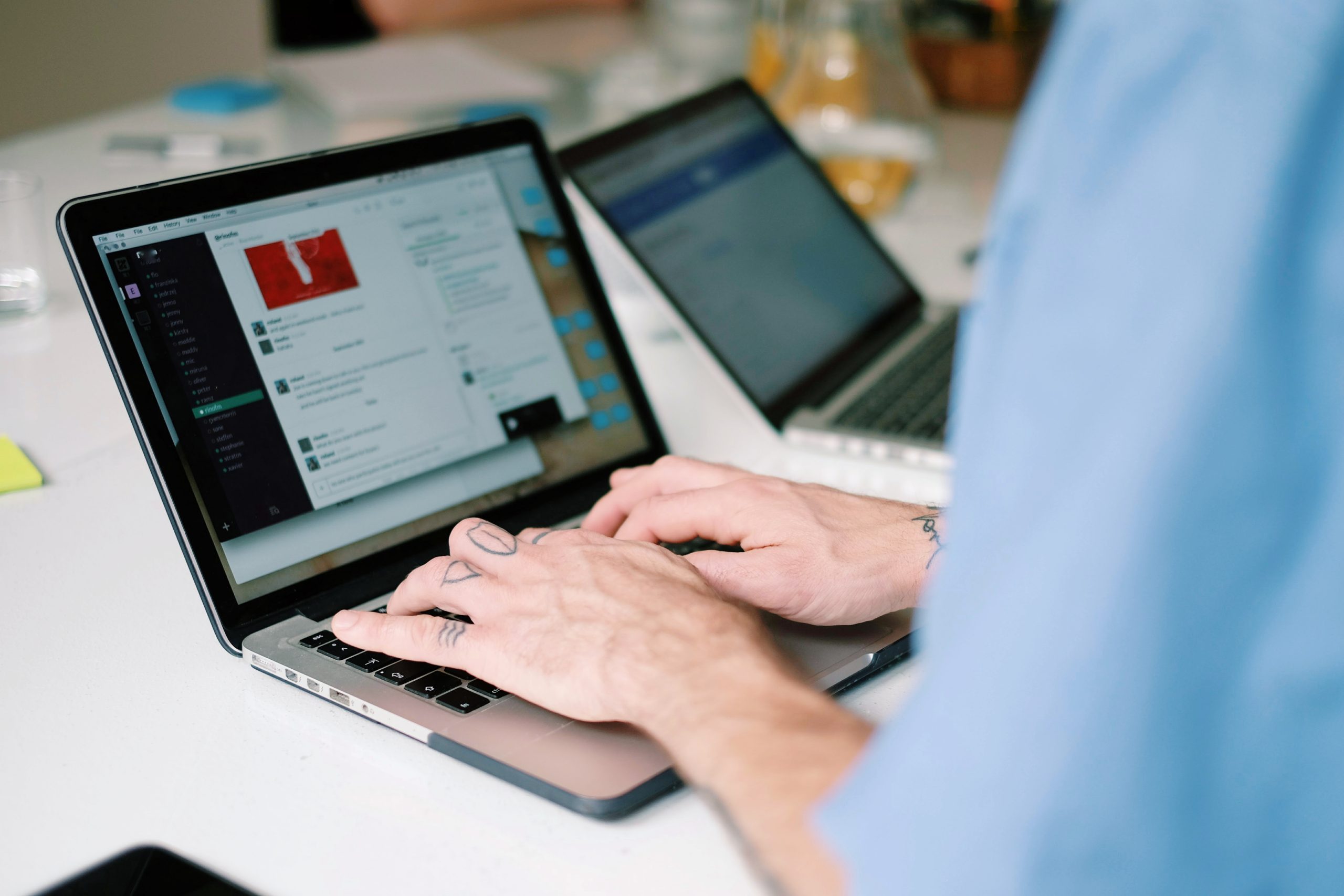 close up man using laptop office scaled