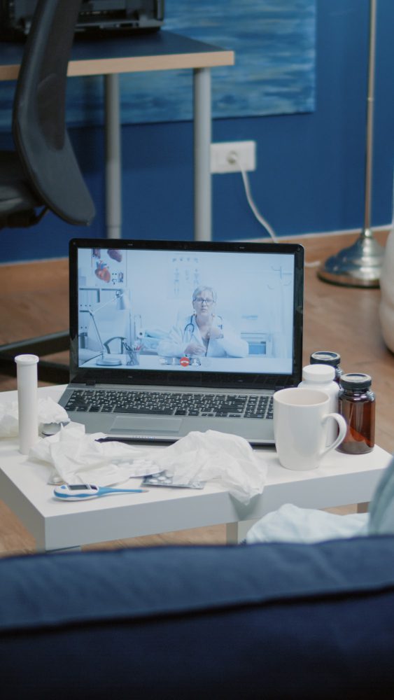 Medical website design in Newcastle - a laptop open on a hospital bed tray table