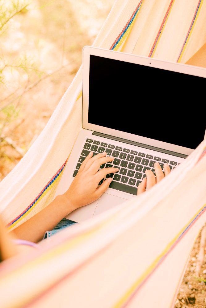 Website design for Newcastle Australia - working on a laptop from a hammock