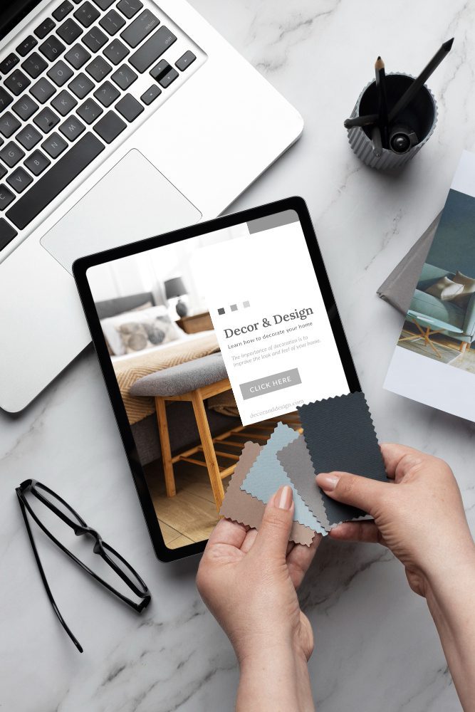 Bathroom website design in Peterlee - hands holding a tile sample beside a tablet showing a bathroom website