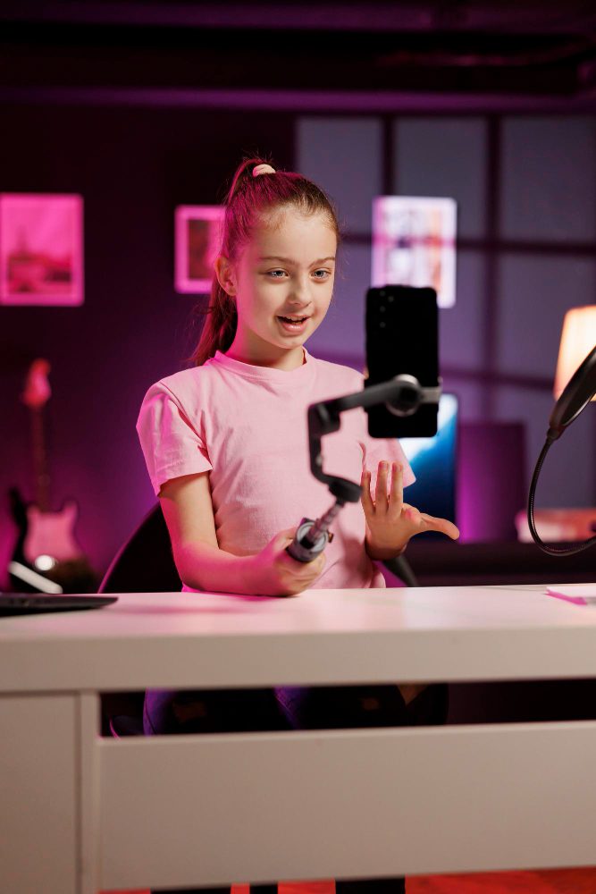 Social media - young creator filming a video with a ring light and phone
