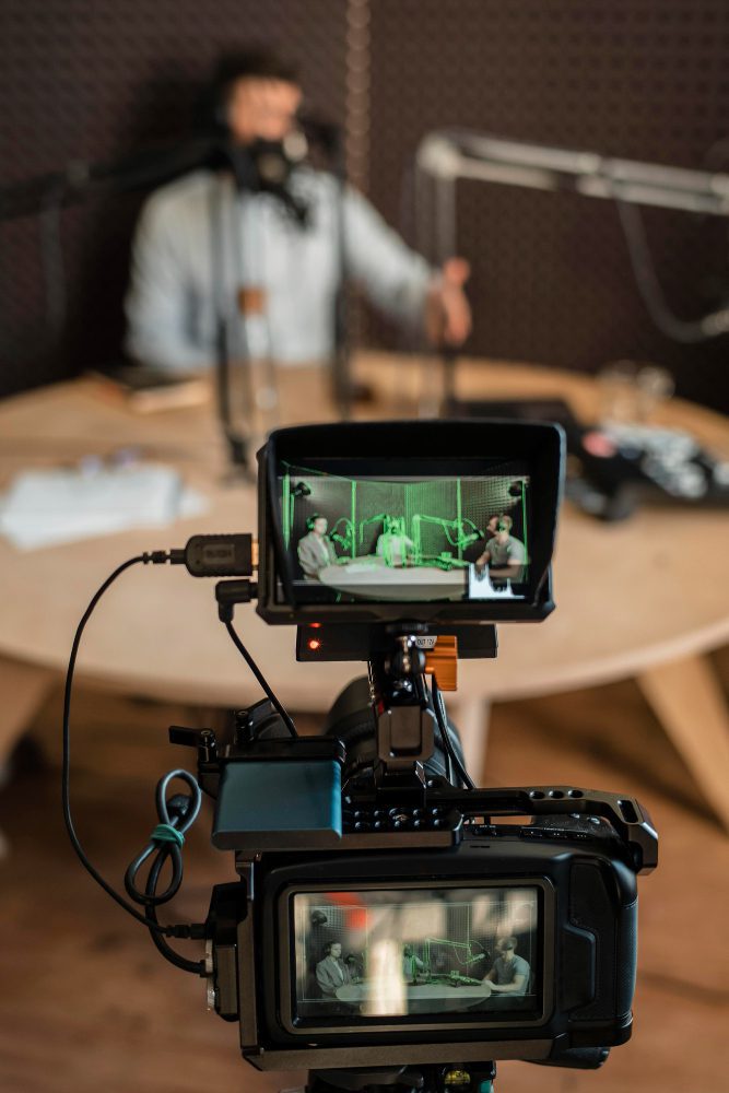 Social media - camera on a tripod filming an interview in a studio