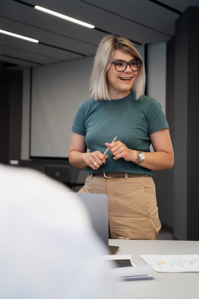 Website design - woman standing at her desk in a studio