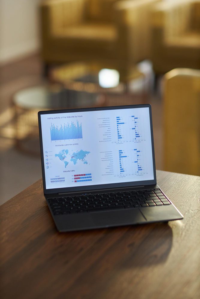 SEO - laptop showing an analytics dashboard on a wooden table