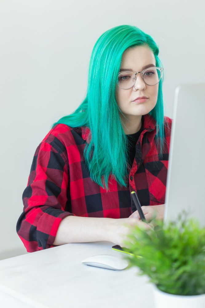Website design in Kembrey Park, Swindon - a designer working at a bright studio desk