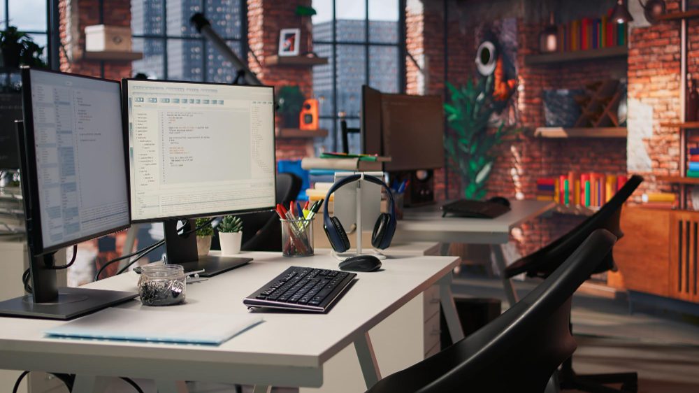 Top web design companies in Durham - a home office desk with dual monitors in a loft