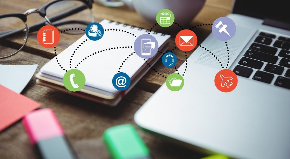 Website design - laptop and tablet with floating contact and email icons