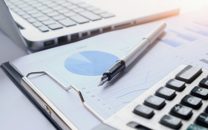 business-concept-with-copy-space-office-desk-table-with-pen-focus-analysis-chart-computer-notebook-cup-coffee-desk-vintage-tone-retro-filter-selective-focus_1418-552