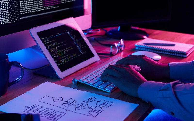 close-up-image-programer-working-his-desk-office-scaled