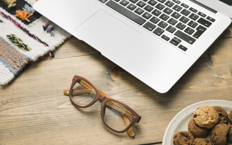 office-desktop-with-laptop-glasses-scaled